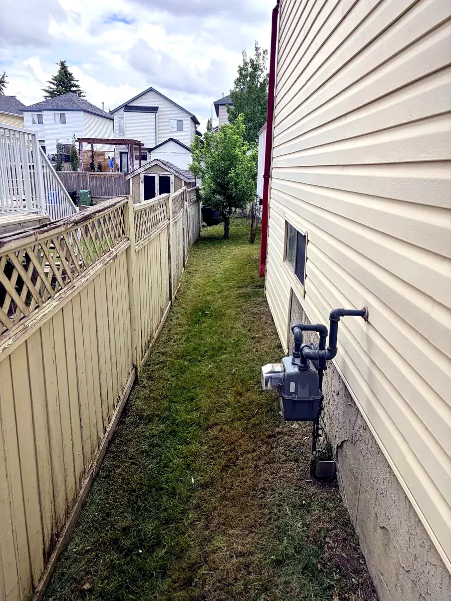 Same Calgary side yard cut clean and tidy by Edge Property Services